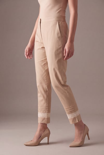 Zarain beige lawn cigarette trouser with pin-tucks and lace, side view showing ankle slit