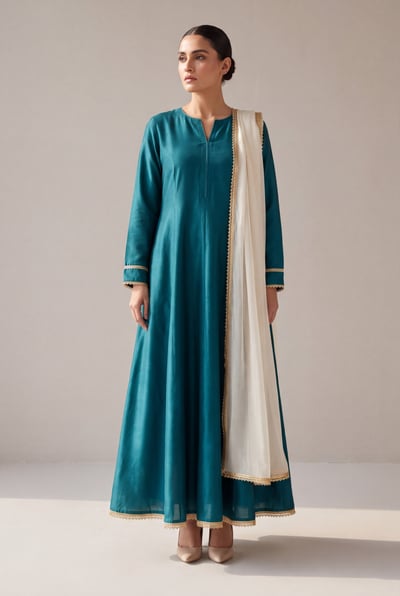 Nain in teal silk, front view showing V-slit neck and flared hem