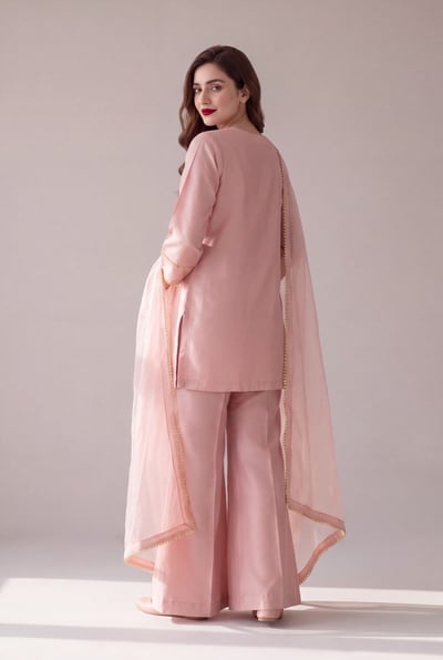 Back view of Ruegul displaying the solid raw silk finish and gold kiran border.