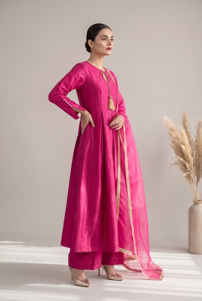 Lina fuchsia raw silk cape maxi suit with gold kiran dupatta, side view